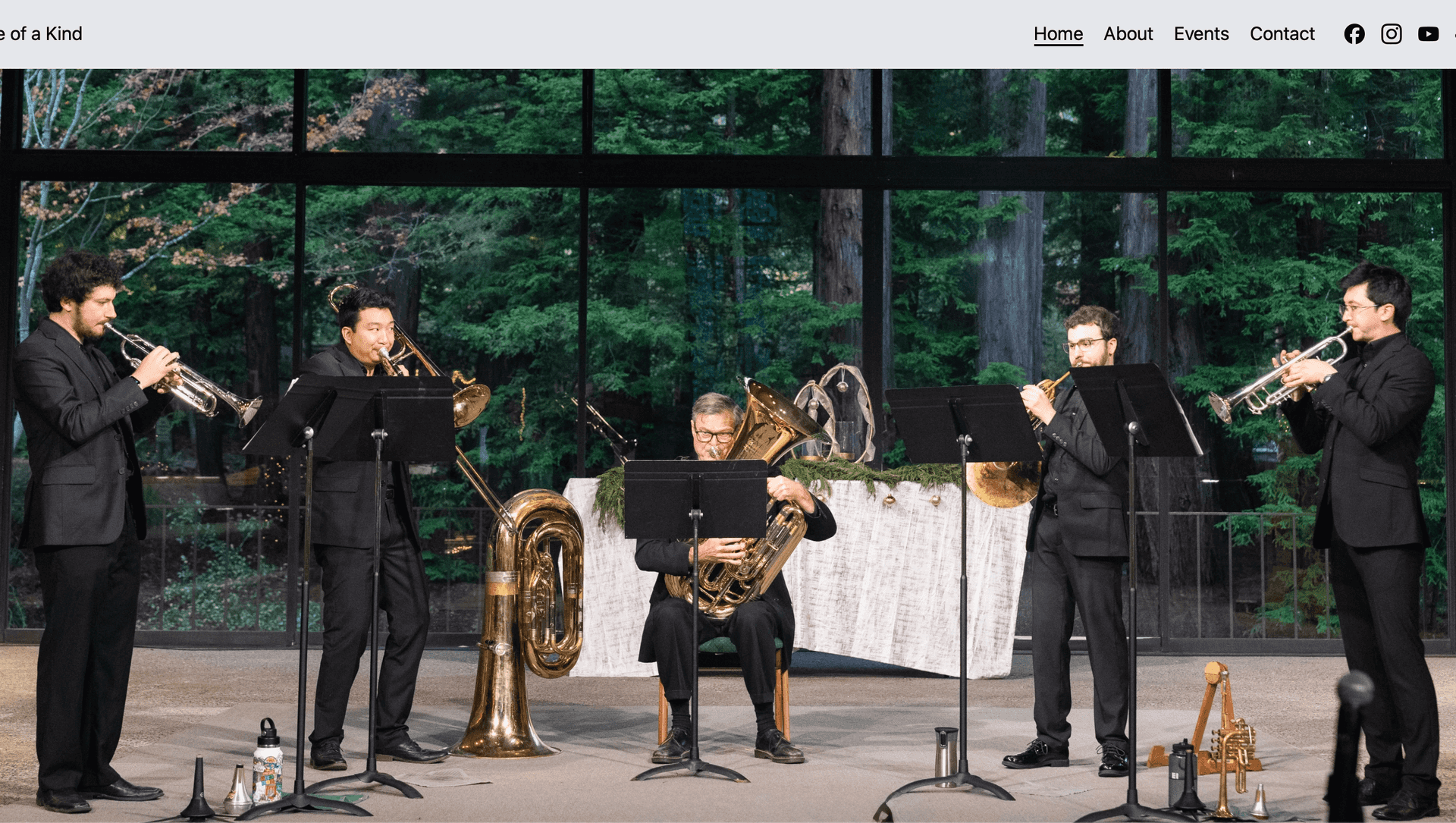 A screenshot of the Five of a Kind brass quintet website main page.